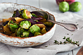 Fried Brussels sprouts and parsnips with thyme