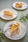 Slices of coconut and mango cheesecake