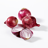 Four red onions, one halved