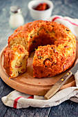 Spicy wreath cake with sausage, Provolone, olives and dried tomatoes