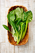 Bok choy in a ceramic bowl (seen from above)