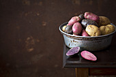 Colorful potatoes in a metal bowl