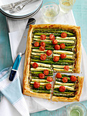 A vegetable tart with tomatoes and asparagus