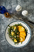 Yellow beets with green beans and hazelnuts