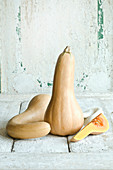Butternut squash against a white wooden background