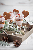 Trifle with crushed gingerbread cookies and lingonberry cream