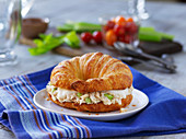 A croissant filled with tuna salad