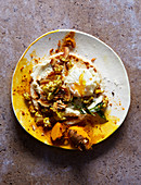 Curry cauliflower and cauliflower puree with a poached egg on flatbread