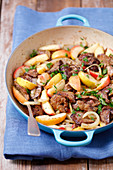 Chicken liver fried with apples and onion