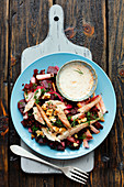 Beetroot salad with black lentils, smoked mackerel, walnuts and horseradish sauce