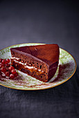 A slice of chocolate tart with jam