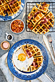 Waffles with bacon and a fried egg for breakfast