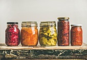Autumn seasonal pickled or fermented colorful vegetables in jars