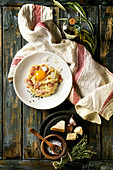 Italian traditional pasta alla carbonara with yolk, pancetta bacon, parmesan cheese, thyme