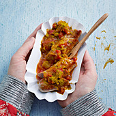 Curried sausage with a tomato and melon sauce for children
