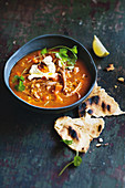 Slow-cooker spiced split-pea soup with harissa labneh