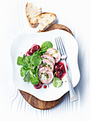 Quail roulade with pickled cherries