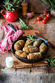 Baked hasselback potatoes with herbs