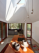 View across kitchen island into living room of architect-designed house