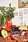 Room with colorful accessories in Asian style, dog on pillow