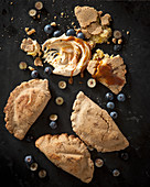 Sweet dumplings filled with bananas, dulce du leche, sour cream and blueberries