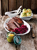 Sauerbraten with potato dumplings and red cabbage