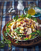 Warm chicken salad with cranberry and walnut sprinkle