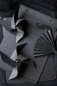 Windmills and fan made from black paper