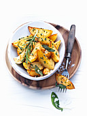 Potato wedges with garlic, salt and herbs