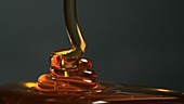 Honey being drizzled, slow motion