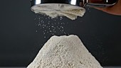 Flour being sifted, slow motion