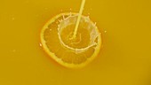 Orange in juice, slow motion