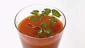 Tomato juice with garnish, slow motion