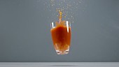 Tomato juice spilling, slow motion