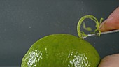 Zesting a lime, slow motion