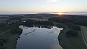 Sunset over a Swiss lake, drone footage