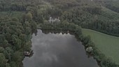 Misty lake at dusk, drone footage