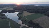 Sunset over a Swiss lake, drone footage