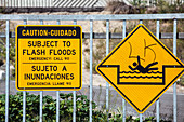 Flash flood warning sign next to Los Angeles River, Long Bea