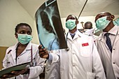 Medical students and doctors examining X-ray