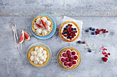 Various tartlets: fig cheesecake, mascarpone tonka, limetto yoghurt with berries, and raspberry cream quark