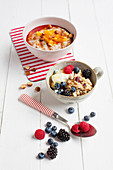 Buckwheat and flaxseed porridge with oranges, and berry muesli with millet flakes