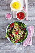 Grilled aubergine, rocket and pomegranate seed salad