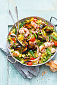 Colourful grilled seafood paella