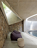 Concrete and stone pool with skylight