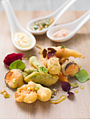 Fried vegetables in chickpea batter with various dips