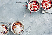 Chocolate ice cream topped with glass noodles, and coconut ice cream with pomegranate