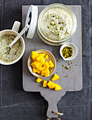 Millet porridge with chia seeds, mango and pistachios