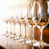 A row of wine glasses in a restaurant