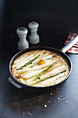 Asparagus omelette in a pan